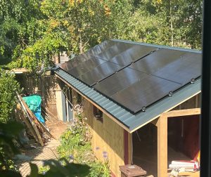 Photo of Judith's outdoor office with solar panels on the roof