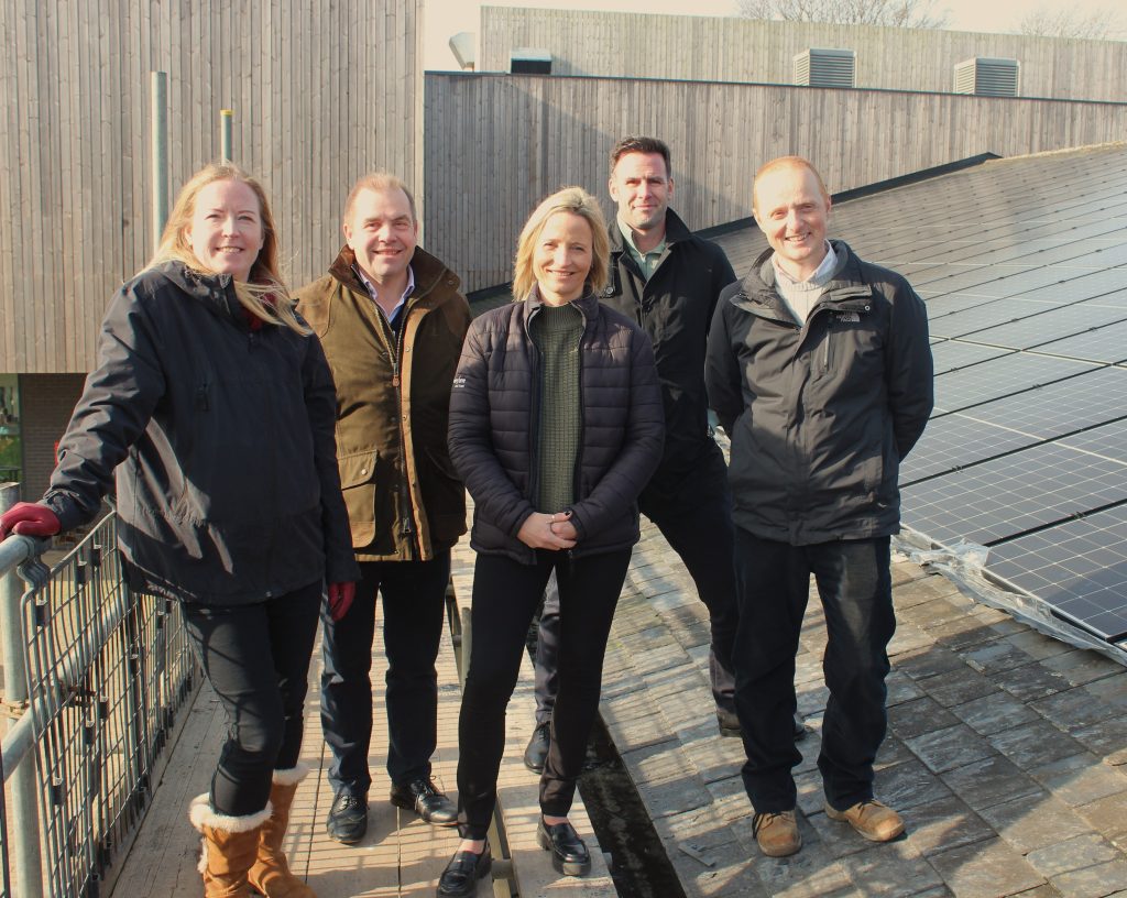 Photo of team at Harpenden Leisure Centre on roof with solar panels