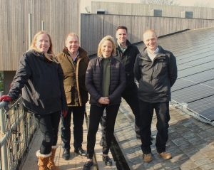 Photo of team at Harpenden Leisure Centre on the roof with solar panels